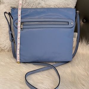 Converts to crossbody or shoulder purse